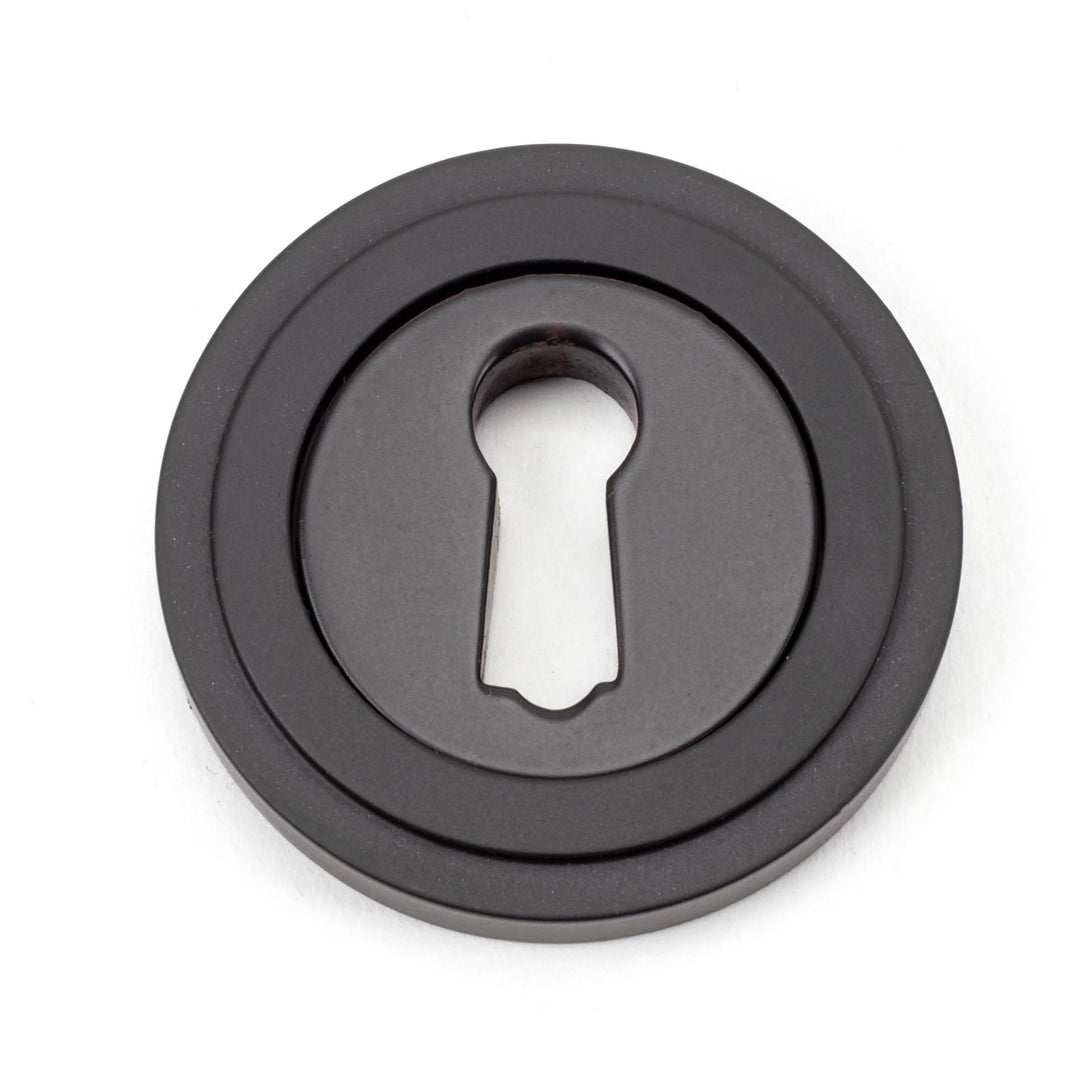 From the Anvil Art Deco Round Escutcheon - itfitz