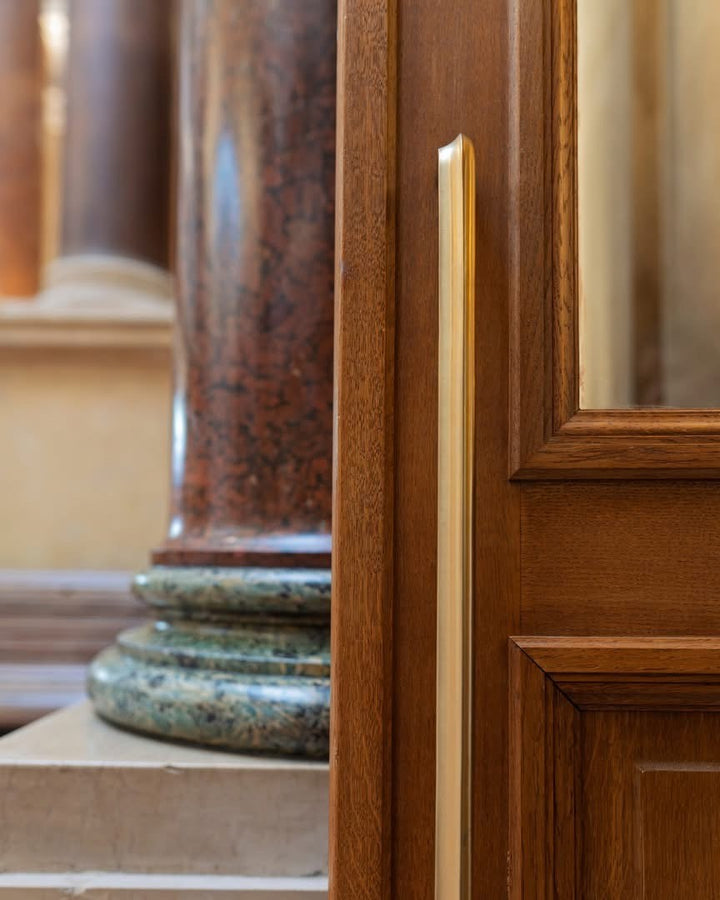 Long door pull handle with satin gold finish, rectangular bar design