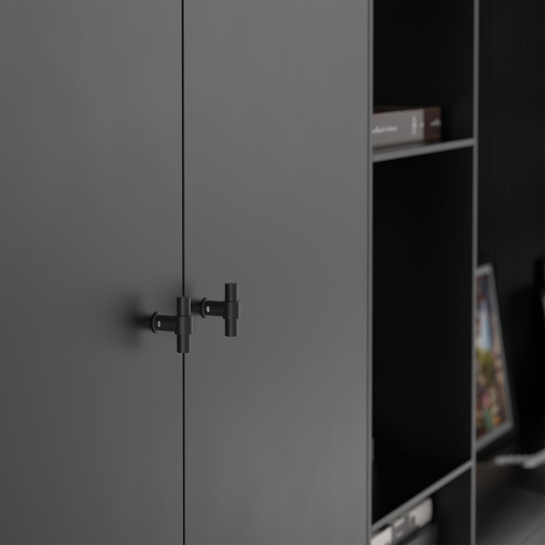 Black T-bar cabinet knob mounted on a flat cabinet door panel
